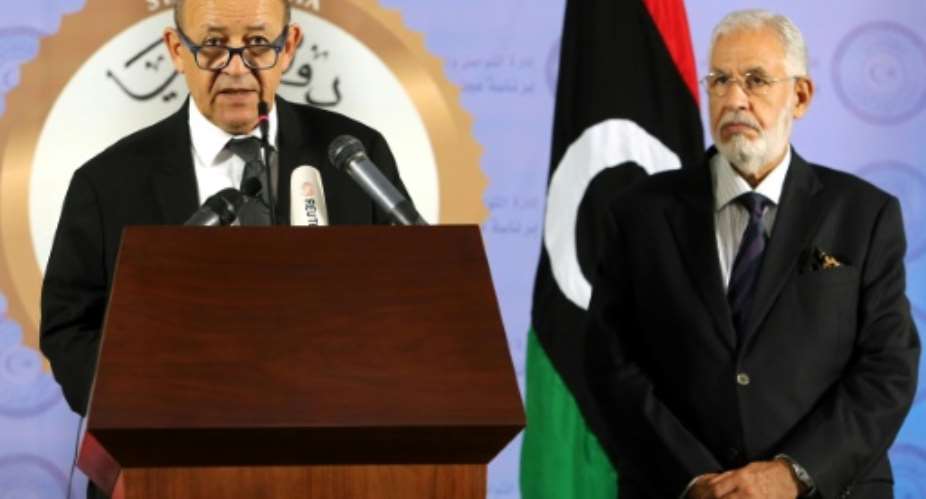 French Foreign Affairs Minister Jean-Yves Le Drian L gives a joint news conference in Tripoli with his Libyan counterpart Mohamed al-Taher Siala.  By MAHMUD TURKIA AFP