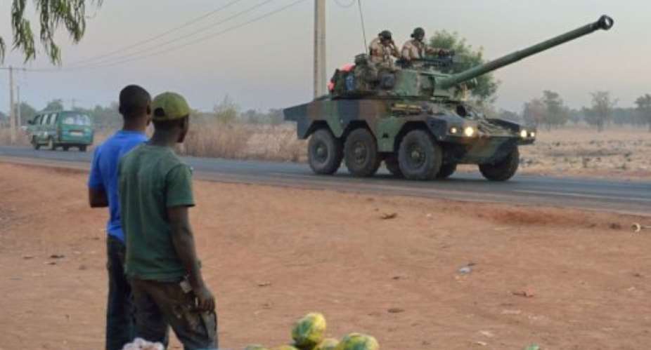 French army soldiers stand on a Sagaie tank on January 15, 2013, near Bamako.  By Eric Feferberg (AFP)