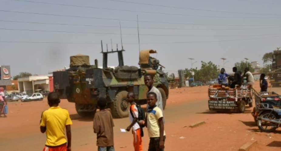 French military vehicles in Niamey on Tuesday as the exit got underway.  By - AFP