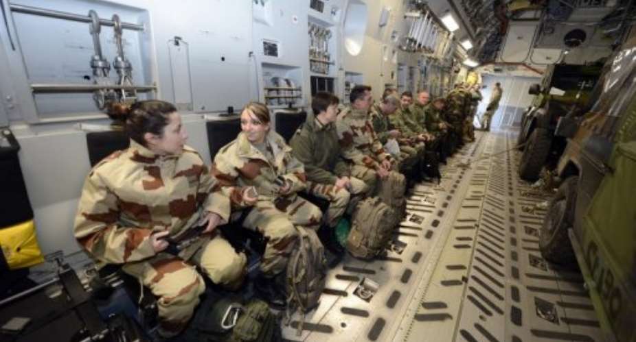 French soldiers aboard a US C17 aircraft at  Istres in France on on January 24, 2012, before taking off for Mali.  By Gerard Julien AFP