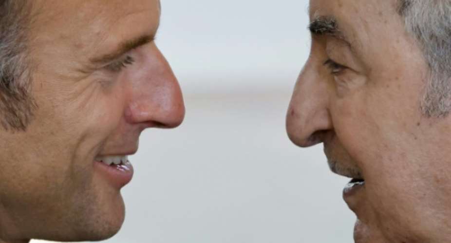French President Emmanuel Macron (L) meets his Algerian counterpart Abdelmadjid Tebboune on the sidelines of a G7 summit in Italy in June..  By Ludovic MARIN (AFP/File)