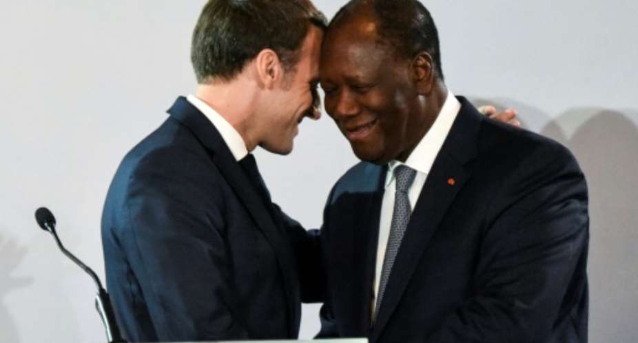 French President Emmanuel Macron L met with his Ivorian counterpart President Alassane Ouattara R.  By SIA KAMBOU AFP