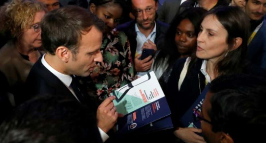 French President Emmanuel Macron, left, at the Vivatech technology fair in Paris on Thursday..  By Michel Euler POOLAFP