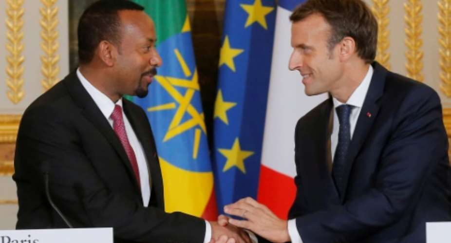French president Emmanuel Macron R and Ethiopian Prime Minister Abiy Ahmed are both keen to present themselves as reformist leaders.  By Michel Euler POOLAFP