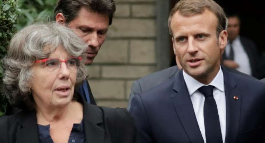 French President Emmanuel Macron with Michele Audin, daughter of Maurice Audin, after visiting Maurice's widow at her home east of Paris to apologise for his torture and death at the hands of French soldiers during the Algerian war.  By Thomas SAMSON AFP