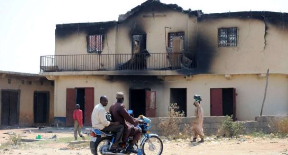A burned building following previous violence in Plateau state.  By Pius Utomi Ekpei (AFP/File)