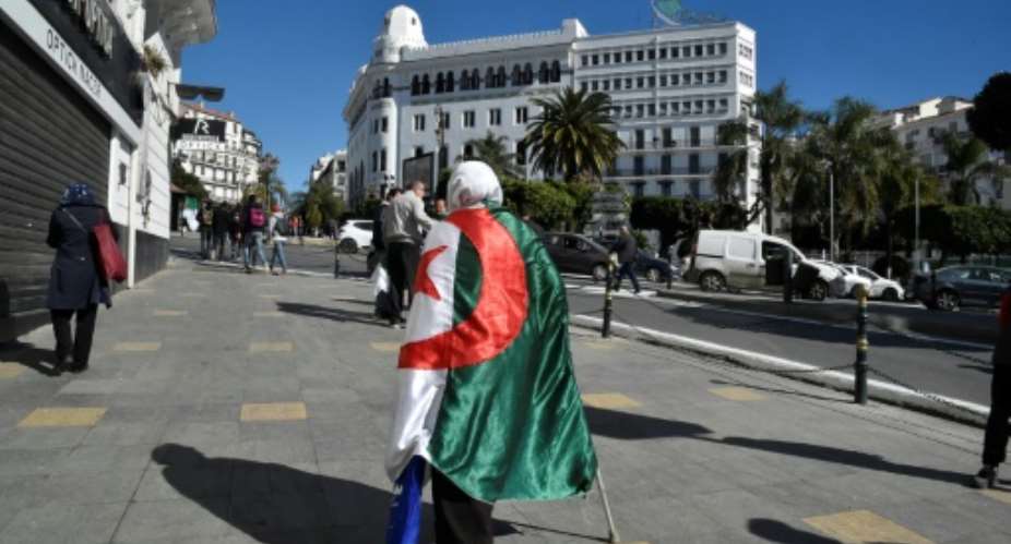 Friday's protest is the first major test of whether Algeria's president has calmed public anger with his vow not to seek re-election.  By RYAD KRAMDI AFP