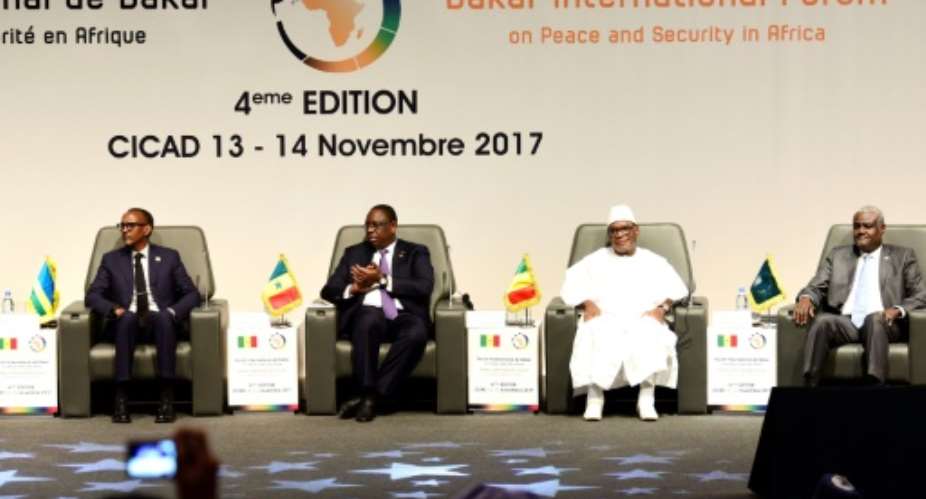 From l Rwanda's president Paul Kagame, Senegal's president Macky Sall, Mali's president Ibrahima Boubacar Keita and AU Commission head Moussa Faki Mahamat at the opening of the Peace and Security forum in Dakar on Monday.  By SEYLLOU AFP
