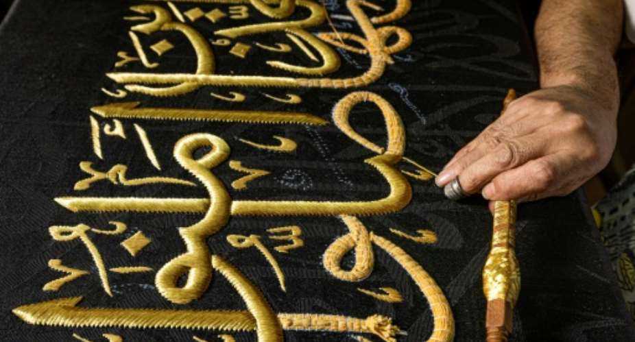 From the 13th century, Egyptian artisans made the kiswa, the giant black cloth that covers the Kaaba in Mecca's Grand Mosque.  By Khaled DESOUKI AFP