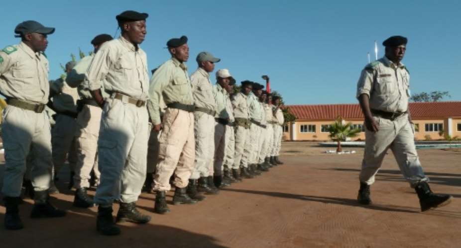 Angolan Luengue-Luiana National Park rangers parade during a ceremony on the eve of the official opening of a new Park Ranger school in Menongue, on June 3, 2016.  By Benjamin Sheppard AFPFile