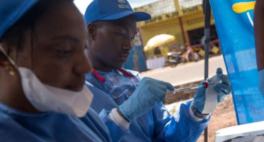 Frontline health workers in DR Congo began to receive the vaccine on Monday, but the rollout is slow -- only a few dozen people are day are getting immunised because of the challenge of keeping the vaccine at extremely low temperatures.  By Junior D. KANNAH AFP