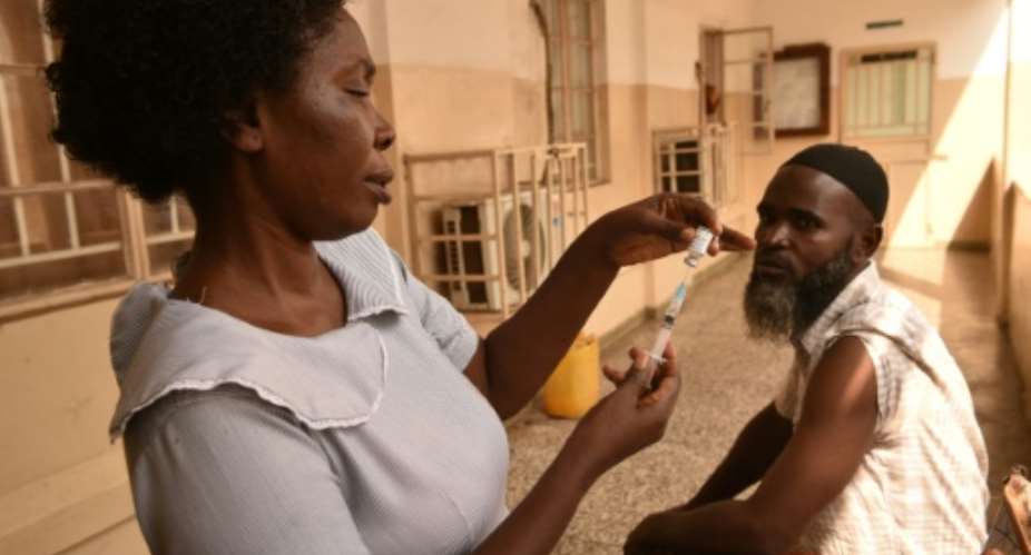 Frontline workers will receive a single dose of the Ervebo vaccine.  By Saidu BAH (AFP)