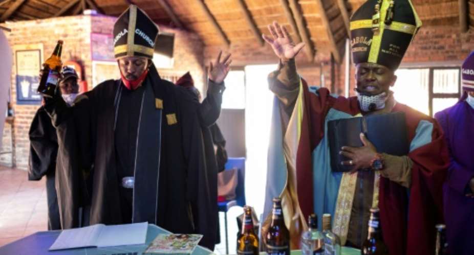 Gabola Church was founded three years ago by Tsietsi Makiti, right, to embrace people who would ordinarily be rejected by conventional churches that frown on imbibers.  By WIKUS DE WET AFP