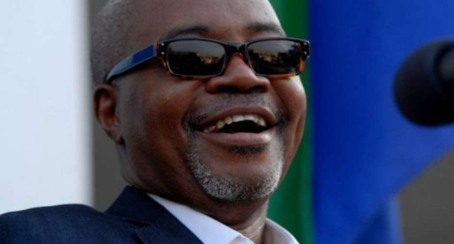 Gabons main opposition leader Andre Mba Obame addresses supporters in August.  By Xavier Bourgois (AFP/File)