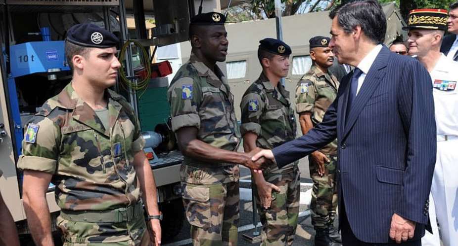 French Prime Minister Francois Fillon greets French soldiers stationed in Gabon during his visit at the Camp de Gaulle.  By Wils Yanick Maniengui (AFP)