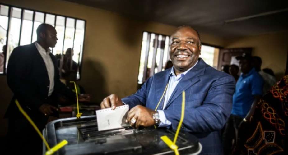 Gabonese President Ali Bongo casts his vote at a polling station in Libreville during the presidential election on August 27, 2016.  By Marco Longari AFP