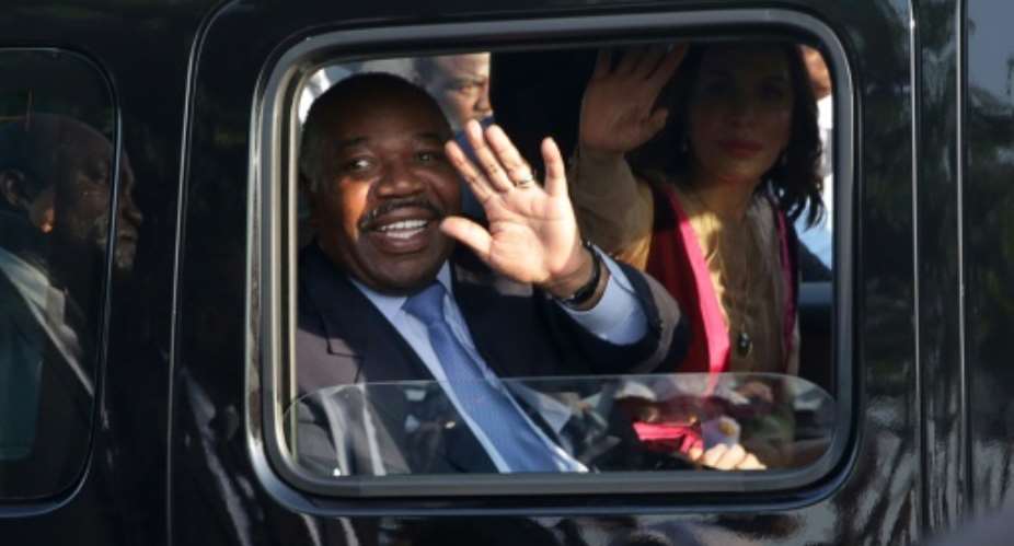 Gabonese President Ali Bongo Ondimba pictured March 2019 called for a smaller government, capable of being exemplary, honest and ethical.  By Steve JORDAN AFPFile