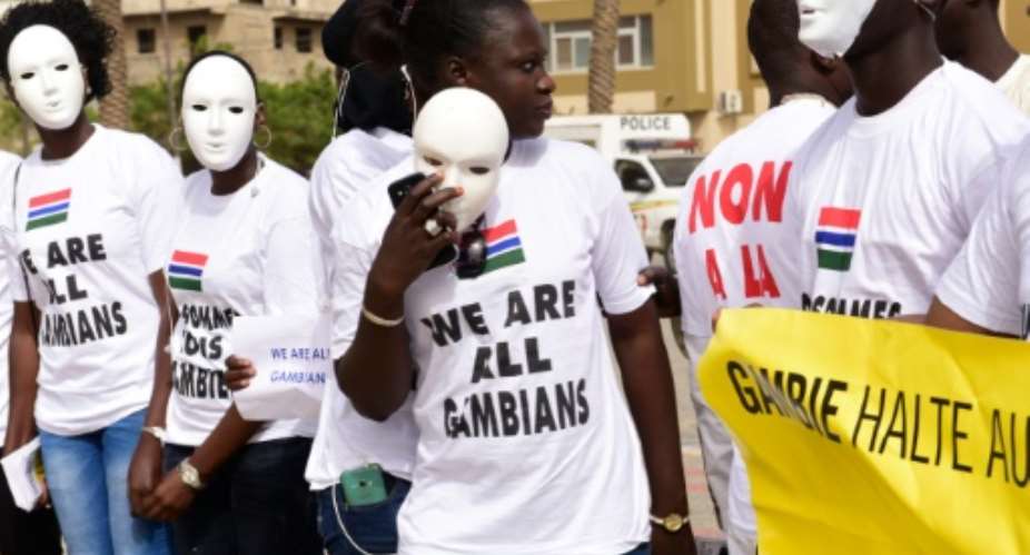 People wearing t-shirts reading We are all Gambian demonstrate in Dakar against alleged human rights violations in Gambia.  By Seyllou AFPFile