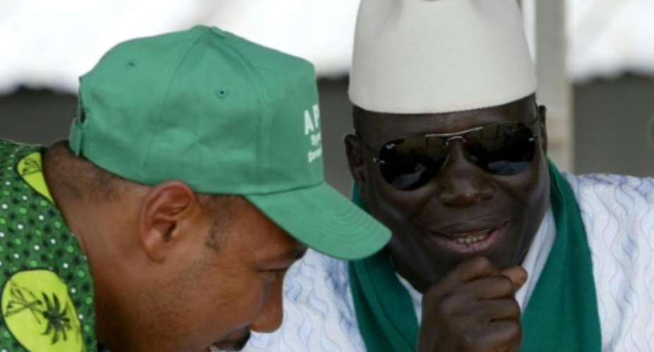 Gambia's former president Yahya Jammeh R and ex-army captain Edward Singhateh, both seen here in 2006, were close allies.  By SEYLLOU DIALLO AFP