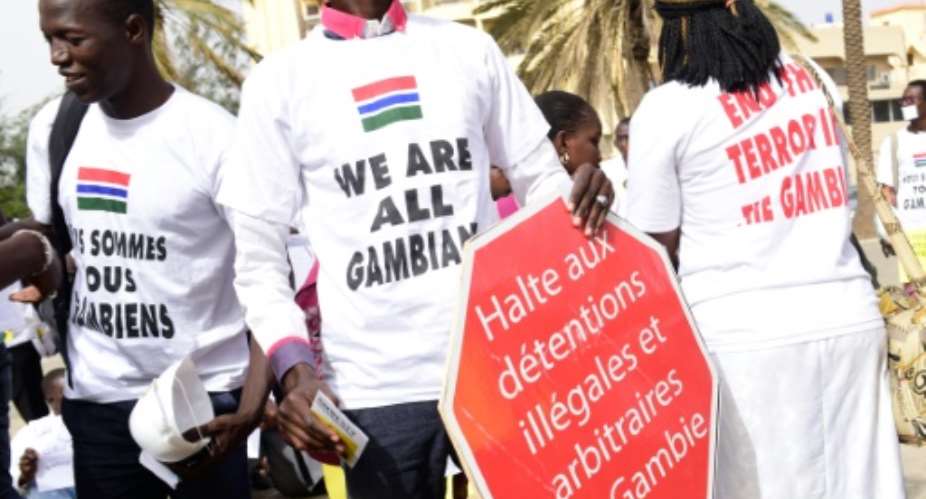 People wearing t-shirts reading We are all Gambian demonstrate in Dakar on April 22, 2016.  By Seyllou AFPFile