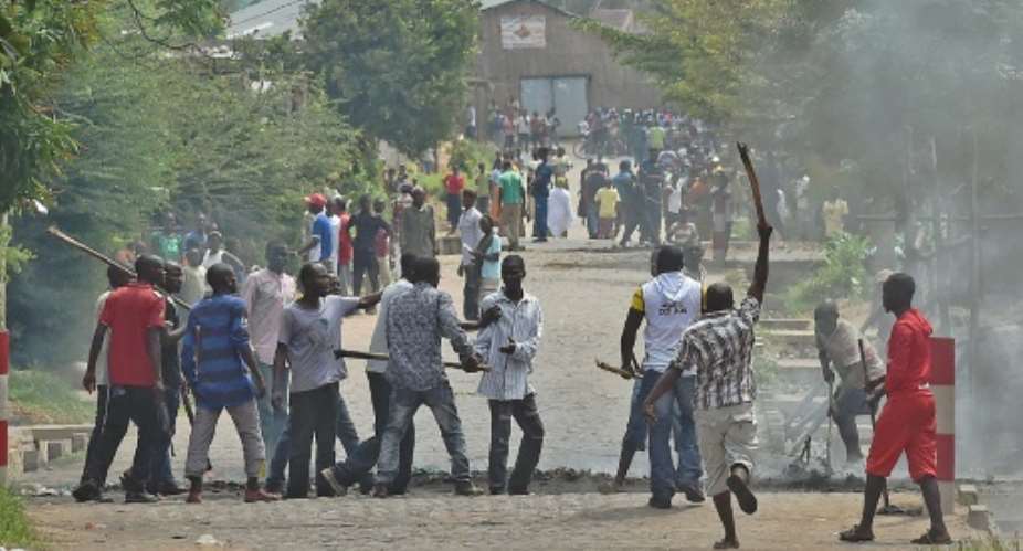A protester opposed to the Burundi President Pierre Nkurunziza's third term is snatched by members of the 'Imbonerakure', the youth wing of the ruling party, in Bujumbura on May 25, 2015.  By Carl De Souza AFPFile