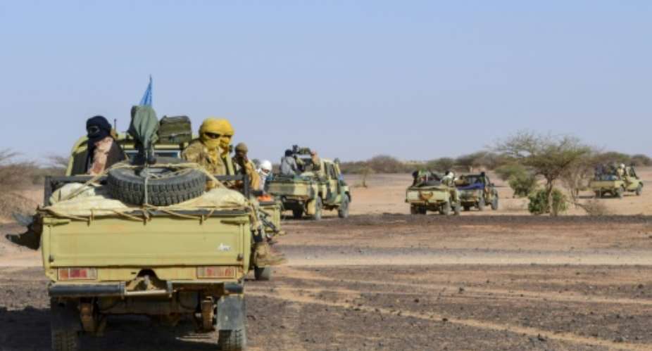 GATIA fighters, shown on a joint patrol with Mali troops, support the central government.  By Souleymane AG ANARA AFPFile