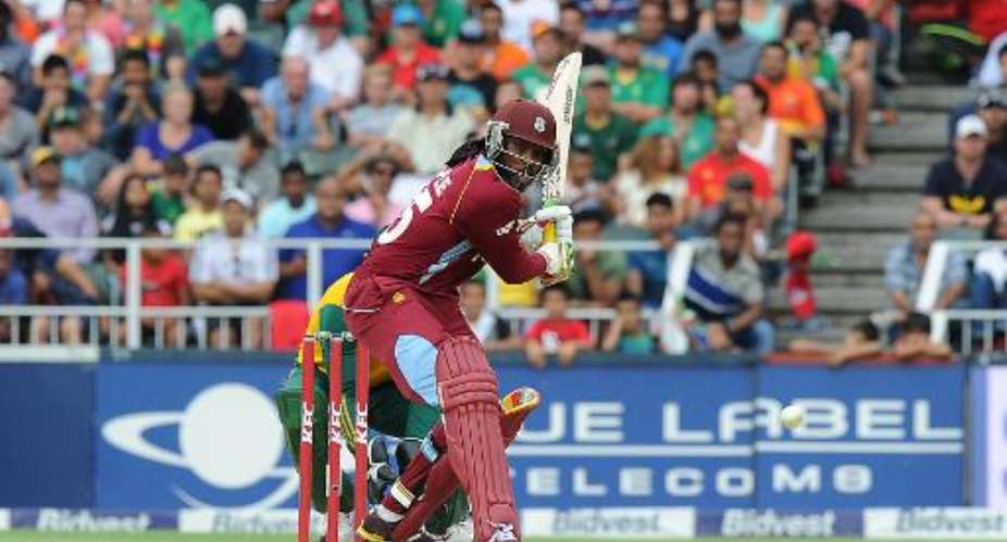 West Indies batsman Chris Gayle gets ready to play a shot during the second T20 cricket match between South Africa and the West Indies at Wanderers cricket stadium in Johannesburg on January 11, 2015.  By Gordon Harnols (AFP)