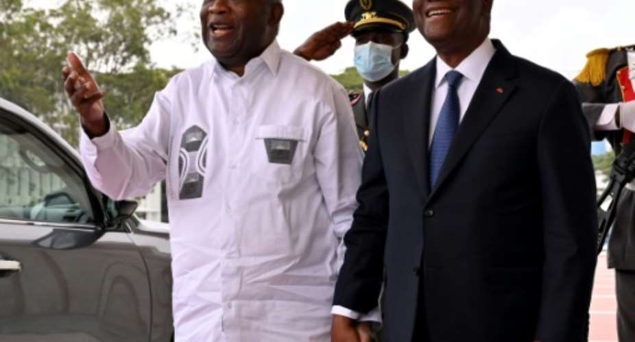 Gbagbo, left, with Ouattara last week. 'He will do all he can to free them as soon as possible,' Gbagbo said Monday.  By Issouf SANOGO AFPFile