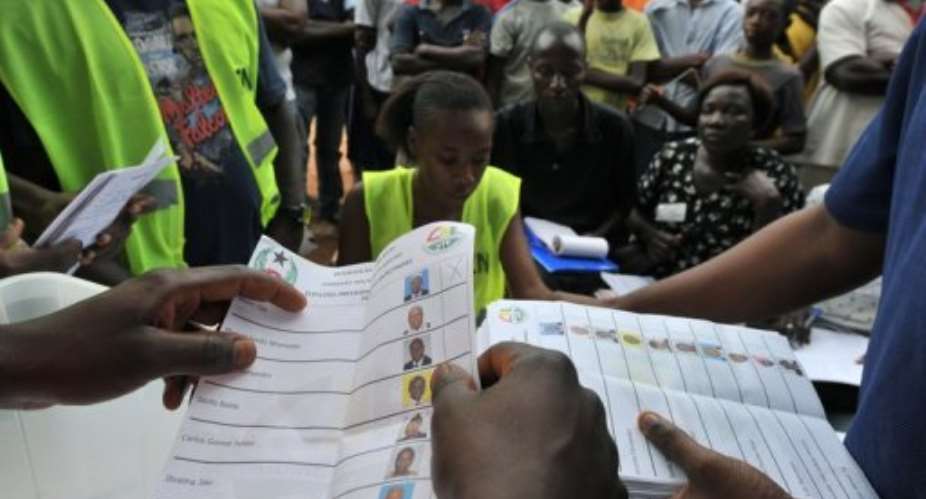 Electoral offciers count ballot papers at a polling station  in Bissau.  By Issouf Sanogo AFP