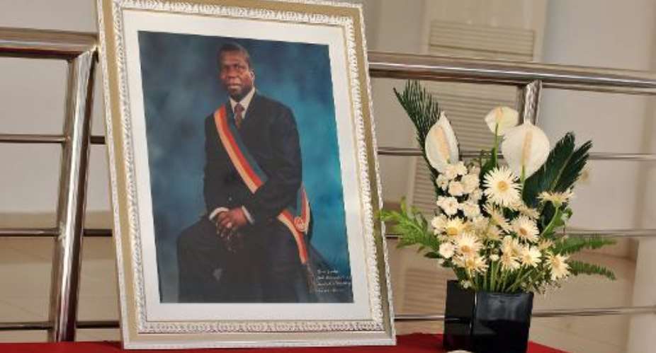 A portrait of slain Guinea-Bissau president Joao Bernardo Vieira stands on a table during his funeral at the National Assembly in Bissau on March 10, 2009.  By Seyllou Diallo AFPFile