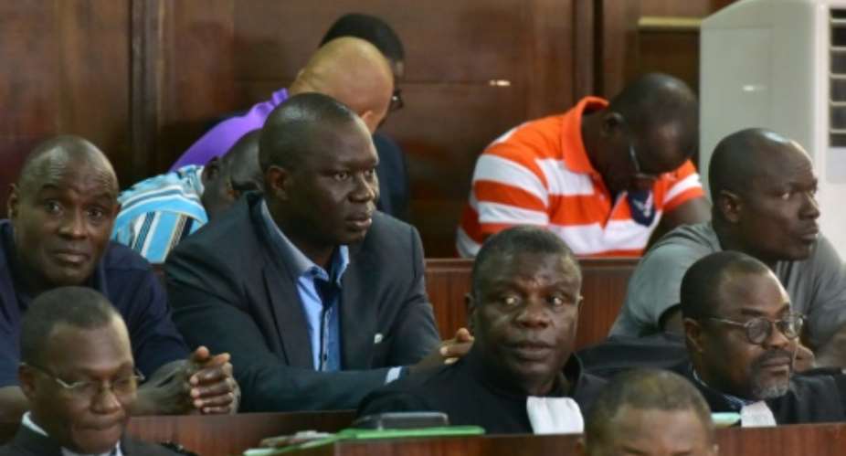 General Brunot Dogbo Ble, seen wearing a blue shirt, was sentenced to 18 years.  By ISSOUF SANOGO AFPFile