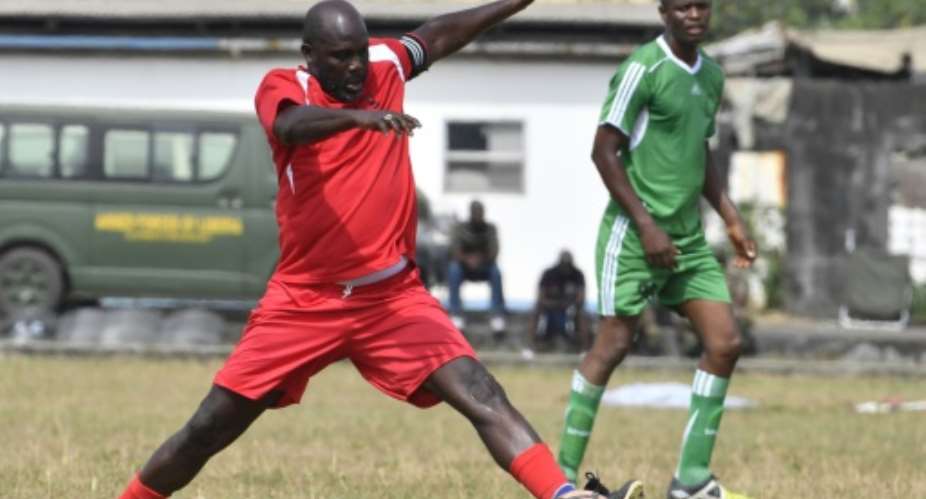 George Weah played in a football match between a 'Weah All Stars' team and the army team in Monrovia two day ahead of his inauguration.  By ISSOUF SANOGO AFP