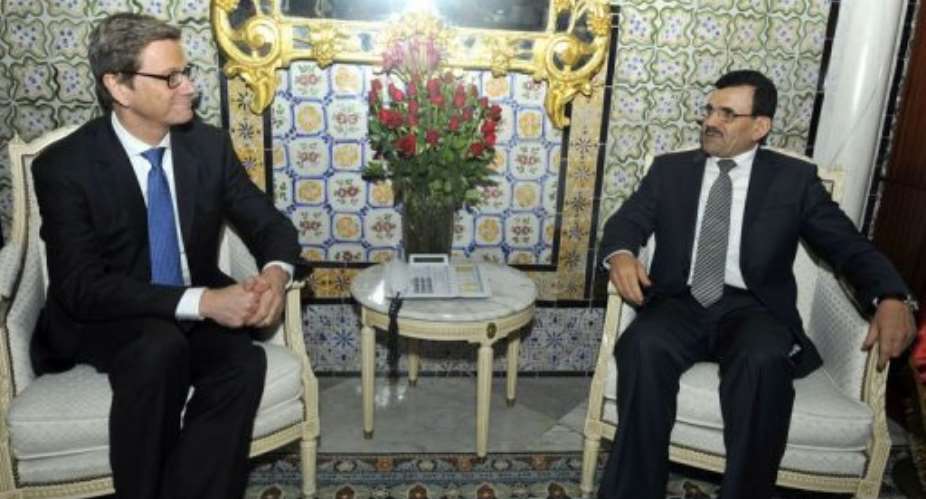 Tunisian PM Ali Larayedh R meets with Germany's Foreign Affairs Minister Guido Westerwelle on March 19, 2013, in Tunis.  By Fethi Belaid AFP