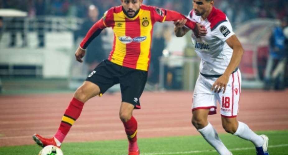 Ghailene Chaalali L of Esperance Tunis holds offWalid el Karti of Wydad Casablanca during the first leg of the 2019 CAF Champions League final in Rabat.  By FADEL SENNA AFPFile