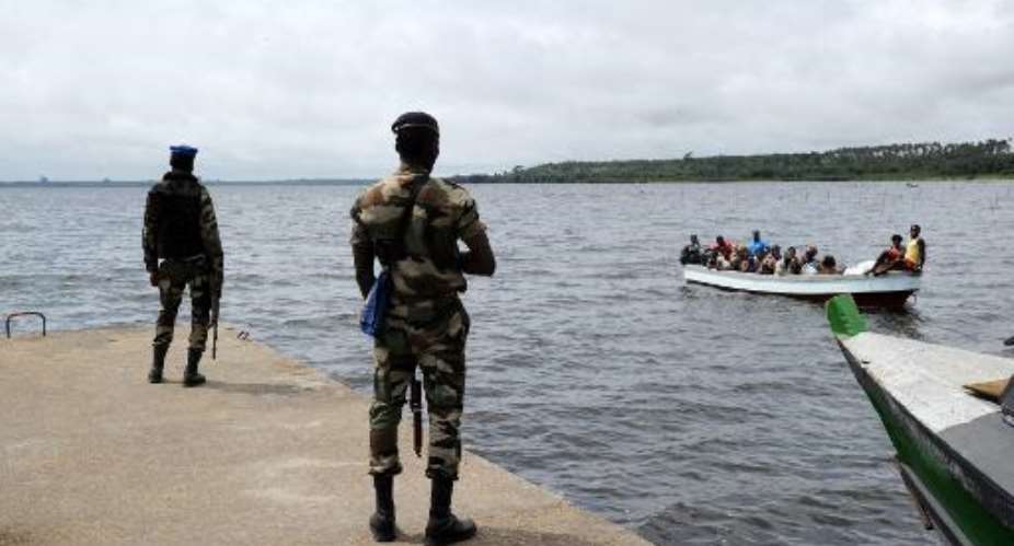 Ivory Coast closed its nearly 700-kilometre 450-mile border after armed men attacked a checkpoint at the Noe border crossing before fleeing to Ghana on September 21, 2014.  By Sia Kambou AFP