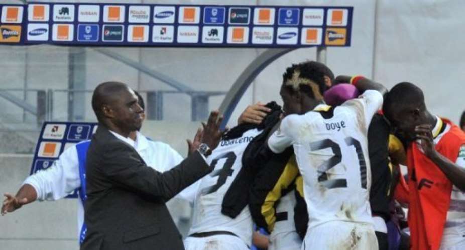Kwesi Appiah left celebrates with his players after Ghana beat Cape Verde in Port Elizabeth on February 2, 2013.  By Issouf Sanogo AFP
