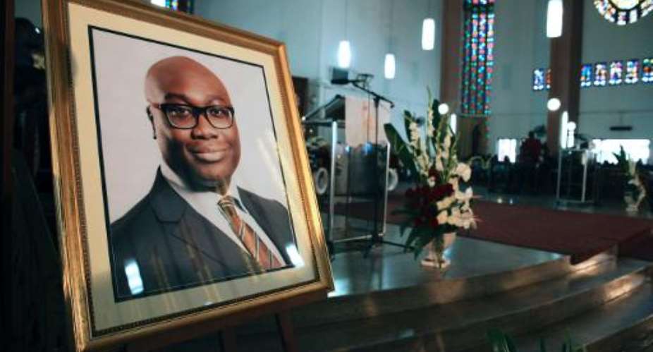 A portrait of BBC presenter Komla Dumor is set during his funeral on February 21, 2014, in Accra, Ghana.  By Chris Stein AFP