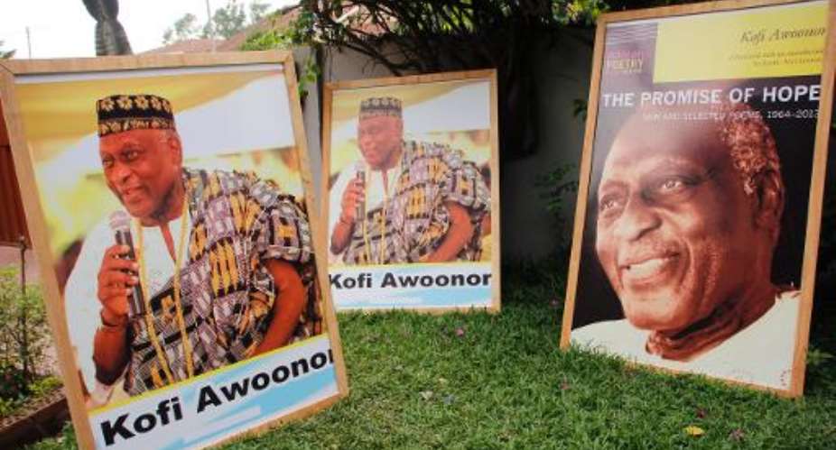 Pictures of Ghanaian poet and statesman Kofi Awoonor are displayed outside his house in Accra on September 30, 2013.  By Chris Stein AFPFile