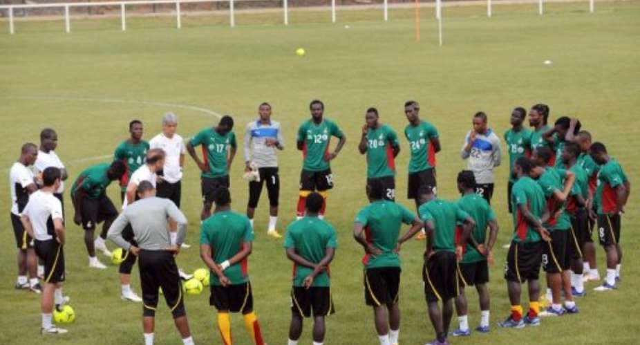Ghanas coach Gora Stevanovic speaks to players during a training session in Ngouni.  By Pius Utomi Ekpei (AFP/File)