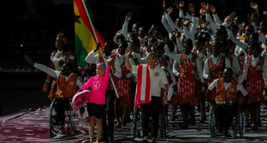 Ghana's flagbearer Abdul Wahid Omar leads the delegation during the opening ceremony of the 2018 Gold Coast Commonwealth Games.  By Adrian DENNIS AFPFile