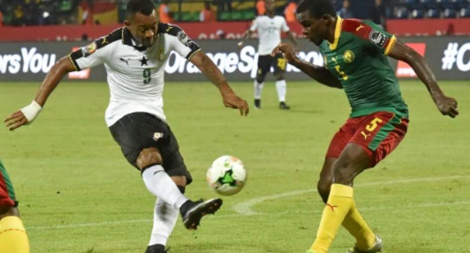 Ghana's forward Jordan Ayew L challenges Cameroon's defender Michael Ngadeu-Ngadjui during the 2017 Africa Cup of Nations semi-final football match between Cameroon and Ghana in Franceville on February 2, 2017.  By ISSOUF SANOGO AFP