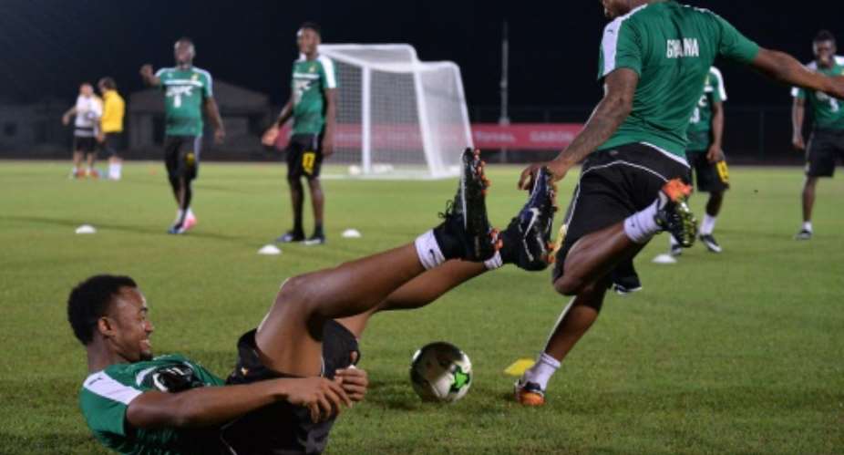 Ghana's Jordan Ayew and Andre Ayew R take part in a team training session in Port-Gentil on January 15, 2017, during the 2017 Africa Cup of Nations tournament in Gabon.  By Justin TALLIS AFP