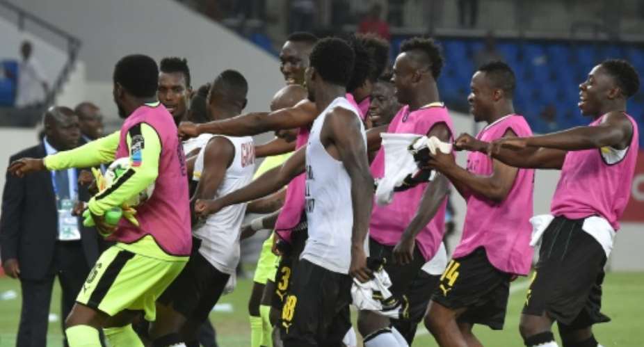 Ghana's players celebrate at the end of their 2017 Africa Cup of Nations quarter-final match against DR Congo, in Oyem, on January 29, 2017.  By ISSOUF SANOGO AFPFile
