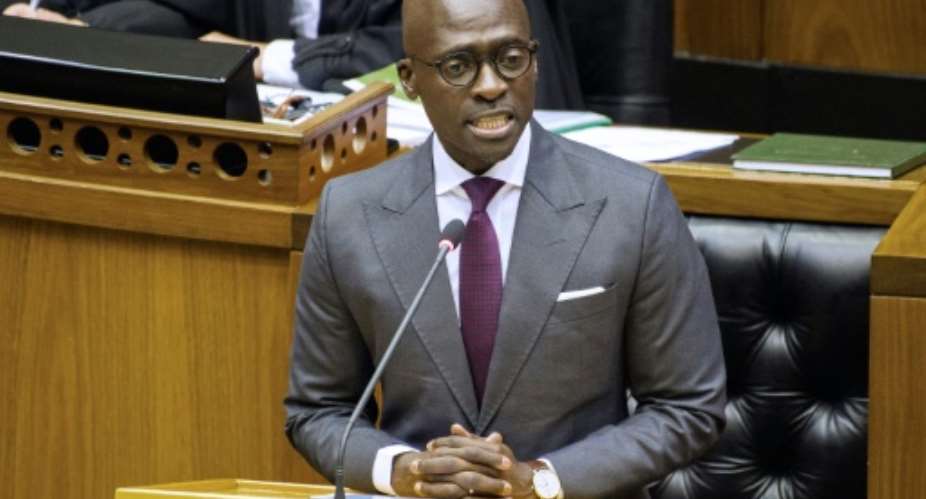 Gigaba, seen here delivering the 2018 budget speech in February, when he was finance minister.  By RODGER BOSCH AFP