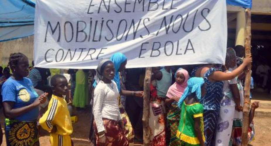 Residents attend an awareness campaign on the haemorragic fever Ebola by local authorities in Lelouma, western Guinea on September 27, 2014.  By Cellou Binani AFPFile