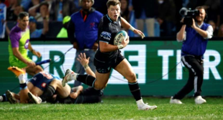Glasgow Warriors centre Huw Jones scores the try that won the United Rugby Championship final against the Bulls in Pretoria..  By Phill Magakoe (AFP)