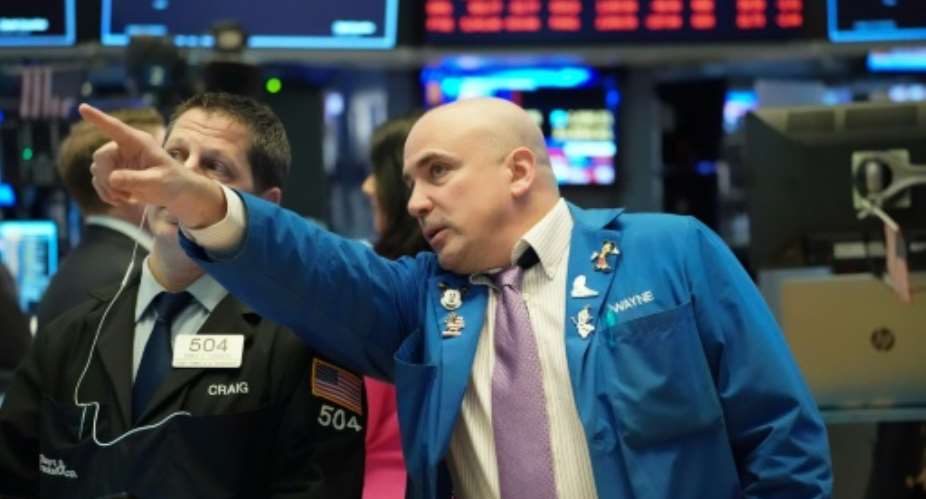Global stock markets suffered historic falls as panic spread Friday over the spiralling coronavirus crisis.  By Bryan R. Smith (AFP)