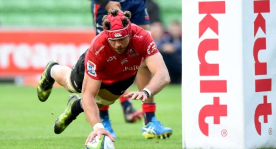 Golden Lions Warren Whiteley dives over for a try in their Super Rugby thumping of the  Melbourne Rebels 47-10.  By Mal Fairclough (AFP)