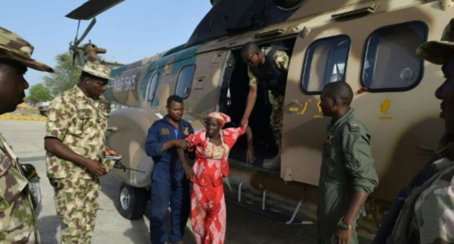 Amina Ali seen alighting from a Nigerian Army helicopter after her release on May 18, 2016 in Damboa, Nigeria.  By Stringer Nigerian ArmyAFPFile