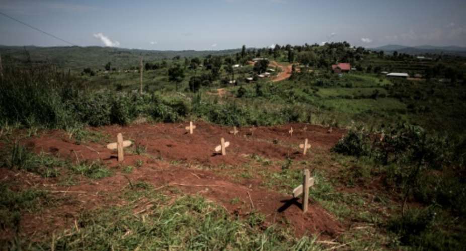Graves of fallen DR Congo soldiers are pictured in July 2019 outside a base in Djugu, eastern DR Congo.  By John WESSELS AFPFile